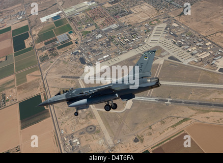 An F-16 Fighting Falcon from the 56th Fighter Wing at Luke Air Force Base, Arizona, performs an SFO during a training mission. Stock Photo