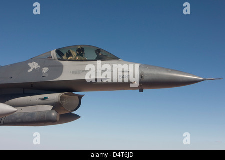A 56th Fighter Wing F-16 Fighting Falcon from Luke Air Force Base, Arizona, manuevers during a training mission. Stock Photo