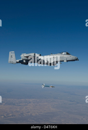 An A-10C Thunderbolt releases a GBU-12 laser guided bomb. Stock Photo