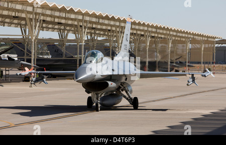 An F-16 pilot from the 162nd Fighter Wing taxi's his aircraft out for another training mission in Tucson, Arizona. Stock Photo