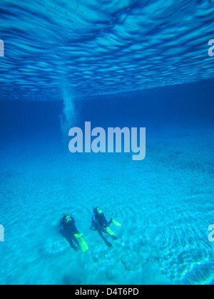 altitude diving in mountain lake Gruener See / gruner see. Austria half mountains half water with divers Stock Photo