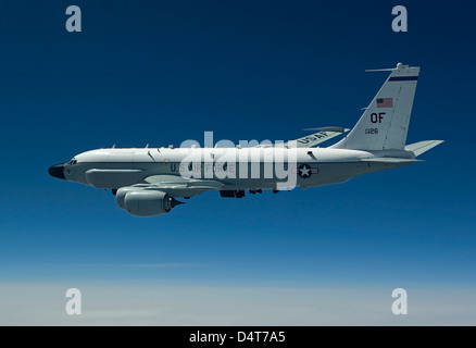 An RC-135W Rivet Joint aircraft flies high over the Midwest on a training mission out of Offutt Air Force Base, Nebraska. Stock Photo