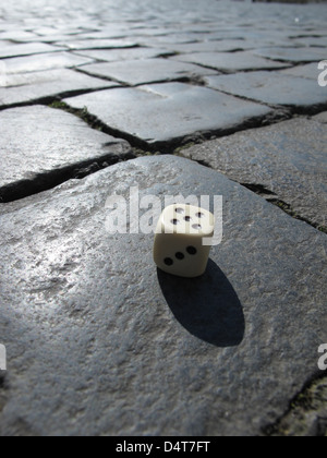 Dice on San Pietro Square - vatican - showing number 5 Stock Photo