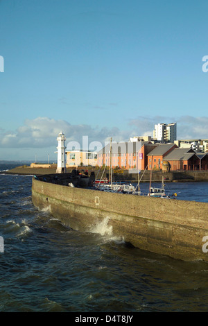 granton harbour port and pier with lighthouse in storm Stock Photo