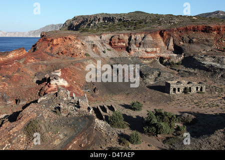 Abandoned Manganese Mine at Cape Vani, Milos Island, Greece. Overview of main opencast mine with ruined buildings. Stock Photo