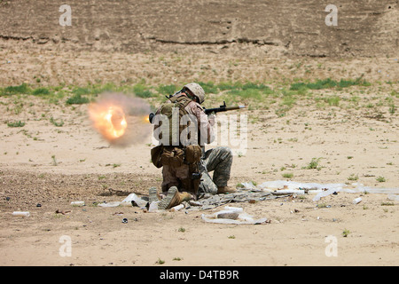 U.S. Army soldier fires a rocket-propelled grenade launcher. Stock Photo