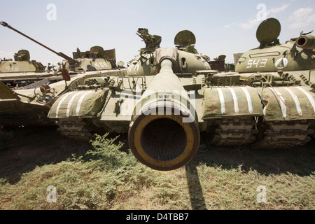 Russian T-54 and T-55 main battle tanks rest in an armor junkyard in Kunduz, Afghanistan. Stock Photo