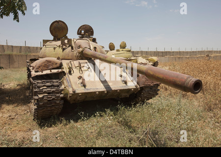 A Russian T-55 main battle tank rests in an armor junkyard in Kunduz, Afghanistan. Stock Photo