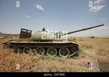 A Russian T-62 main battle tank rest in an armor junkyard in Kunduz, Afghanistan. Stock Photo