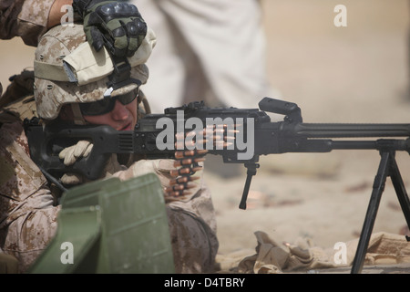 U.S. Marine firing PK 7.62mm general-purpose machine gun at a shooting range near Kunduz, Afghanistan. Stock Photo