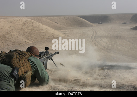 A U.S. Army soldier fires a Barrett M82A1 rifle on a firing range in Kunduz, Afghanistan. Stock Photo