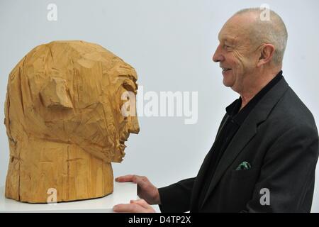 German artist Georg Baselitz stands in front of the wooden sculture ?Untitled? (1982) in the exhibition ?Baselitz? at Frieder Burda Museum in Baden-Baden, Germany, 17 November 2009. The exhibition offers a comprehensive insight into the artistic work of Georg Baselitz and will be on display at Frieder Burda Museum and Staatliche Kunsthalle Baden-Baden from 21 November 2009 until 14 Stock Photo
