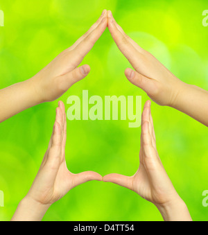 House made of woman hands isolated on field Stock Photo - Alamy
