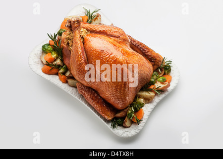 Roast stuffed chicken with vegetables Stock Photo