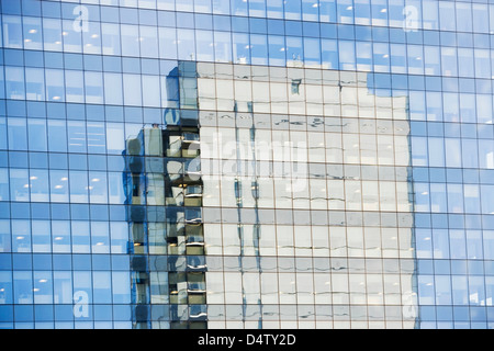 Skyscraper reflected in windows Stock Photo