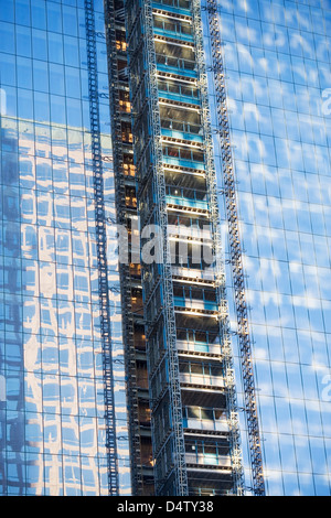 Scaffolding on urban skyscraper Stock Photo