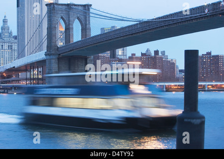 Blurred view of boat on urban river Stock Photo