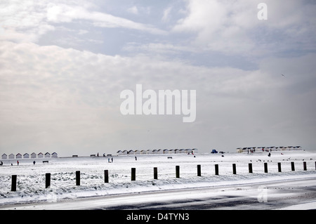 Snow and beach huts at the Green Sward, Goring, West Sussex, UK Stock Photo