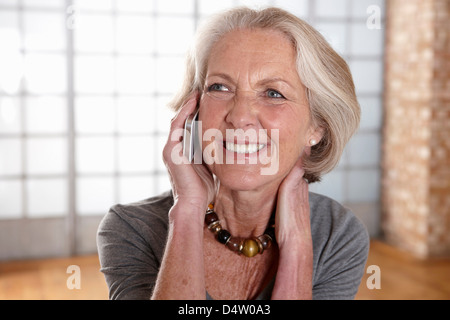 Older woman talking on cell phone Stock Photo