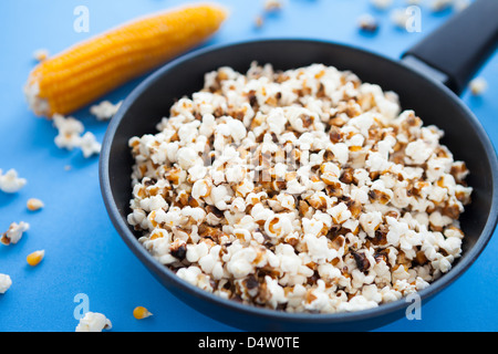 Delicious home cooking popcorn in a pan, closeup Stock Photo