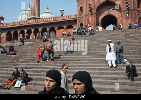 People on the steps outside Jama Masjid mosque in Old Delhi, India. Stock Photo