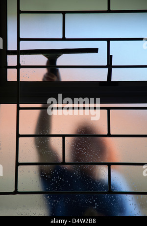 Person Cleaning Windows from outside Stock Photo