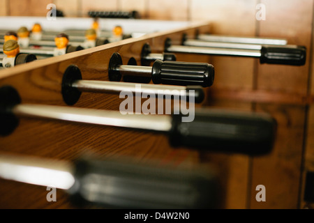 Close up of handles on foosball table Stock Photo