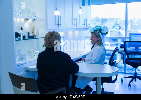 Doctor and patient talking in office Stock Photo