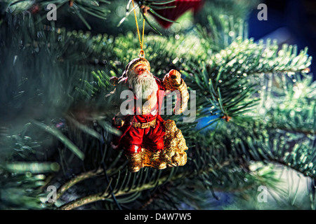 Santa Christmas ornament on tree Stock Photo