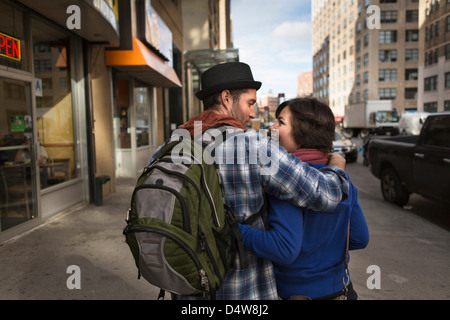 Couple walking on city street Stock Photo
