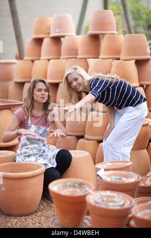 Woman shopping for planters in nursery Stock Photo