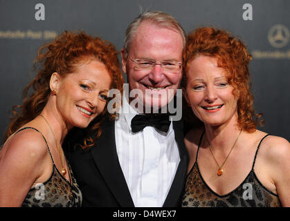 Former President of BDI (Federation of German Industries) Hans-Olaf Henkel, his wife Bettina Henkel (L) and her twin sister Almut pose for a picture on the red carpet of the German Press Ball at Hotel Intercontinental in Berlin, Germany, 26 November 2010. The German Press Ball is a gathering of celebrities, politicians, businessmen, socialites and media representatives. Photo: Jens Stock Photo