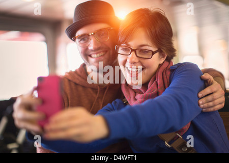 Couple taking picture with cell phone Stock Photo