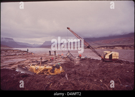 Log Boom near Northeast Tip of Lake Powell, Site of Clean - Up Operation Following Massive Oil - Spill Into the San Juan River Dragline Scoops Up Oil - Soaked Debris, 10/1972 Stock Photo