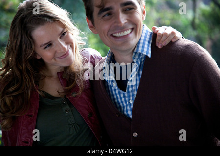 Smiling couple hugging outdoors Stock Photo