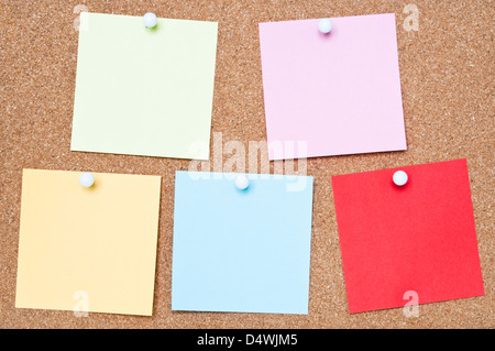 Selection of blank adhesive notes attached to a cork Stock Photo