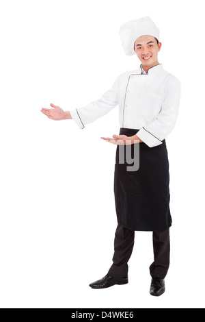 happy asian chef with welcome gesture Stock Photo