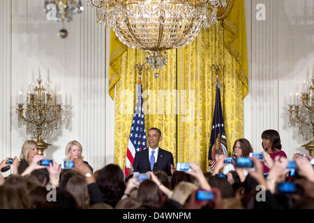 Washington DC, USA. 18th March 2013. United States President Barack Obama, center, speaks at the Women's History Month Reception in the East Room of the White House with Dr. Jill Biden, wife of Vice President Joe Biden, Catherine Russell, chief of staff to Jill Biden, Amanda McMillan, and First Lady Michele Obama in Washington, D.C., U.S., on Monday, March 18, 2013. .Credit: Andrew Harrer / Pool via CNP/dpa/Alamy Live News Stock Photo