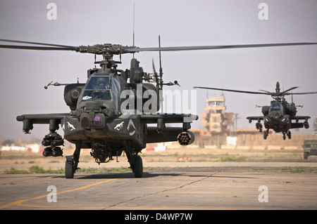 Two AH-64 Apache helicopters return from a mission over Northern Iraq during Operation Iraqi Freedom. Stock Photo