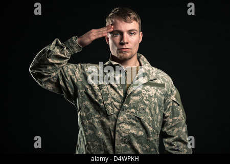 Military young man salutes. Studio portrait Stock Photo - Alamy