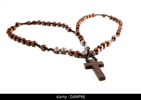 Wooden rosary beads and cross isolated on a white background. Stock Photo