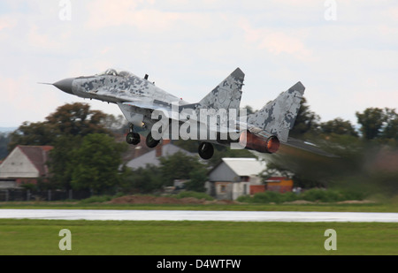 Slovak Air Force MIG-29 Fulcrum taking off, adorned with an experimental digital camouflage, Hradec Kralove, Czech Republic. Stock Photo