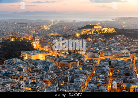 Athens skyline aerial view in the afternoon with the lights over blue hour, Syntagma, Greek Parliament and Parthenon are visible Stock Photo