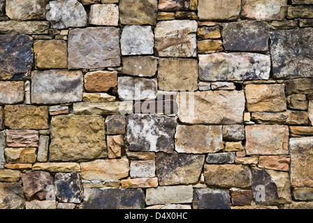 A beautifully designed natural rock wall. Many colors and sizes mixed for interest. Stock Photo