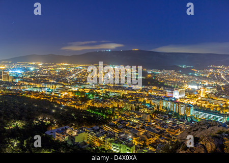 Athens skyline aerial view in the afternoon with the lights over blue hour Stock Photo