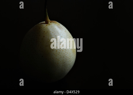 Nashi / Asian pear isolated on dark background Stock Photo