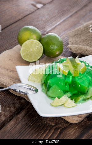 Lime Jello with fresh fruits in the background Stock Photo