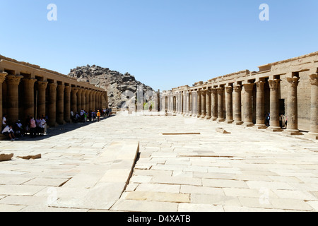 Egypt. The outer courtyard flanked by colonnades which leads to the first temple of Isis pylon on Philae (Agilkia Island). Stock Photo