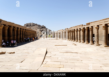 Egypt. The outer courtyard flanked by colonnades which leads to the first temple of Isis pylon on Philae (Agilkia Island) . Stock Photo