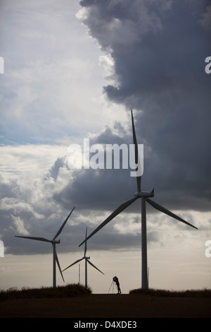 A photographer takes a picture at ScottishPower's Whitelee windfarm, East Renfrewshire. Stock Photo